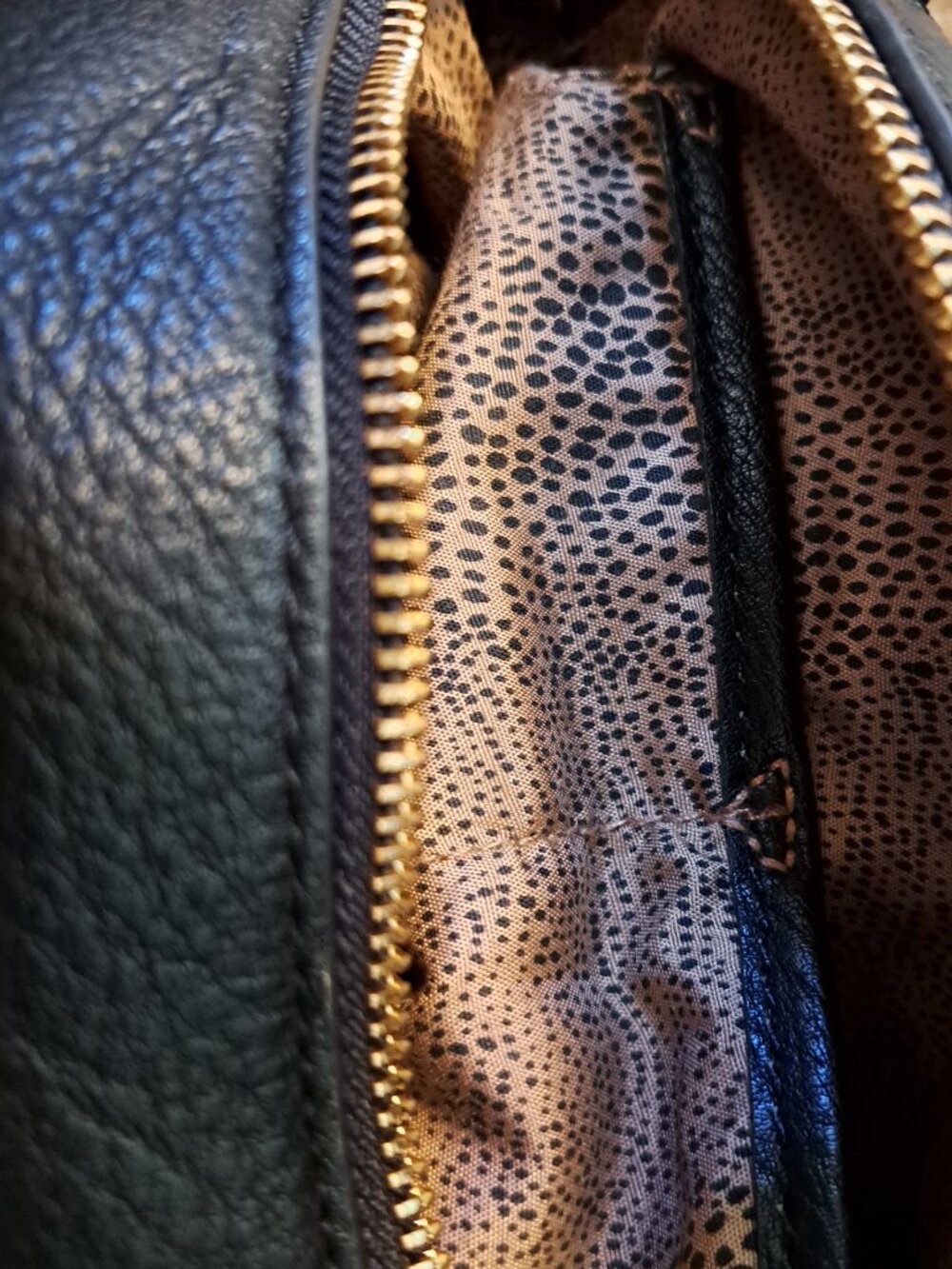 Black Steve Madden embroidered floral backpack with gold hardware. - Picture 8 of 13